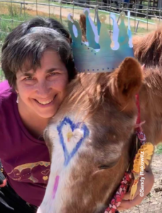 Sandy Rakowitz, Founder of Paint the Pony Global Healing Event pictured with her 37 year old horse.